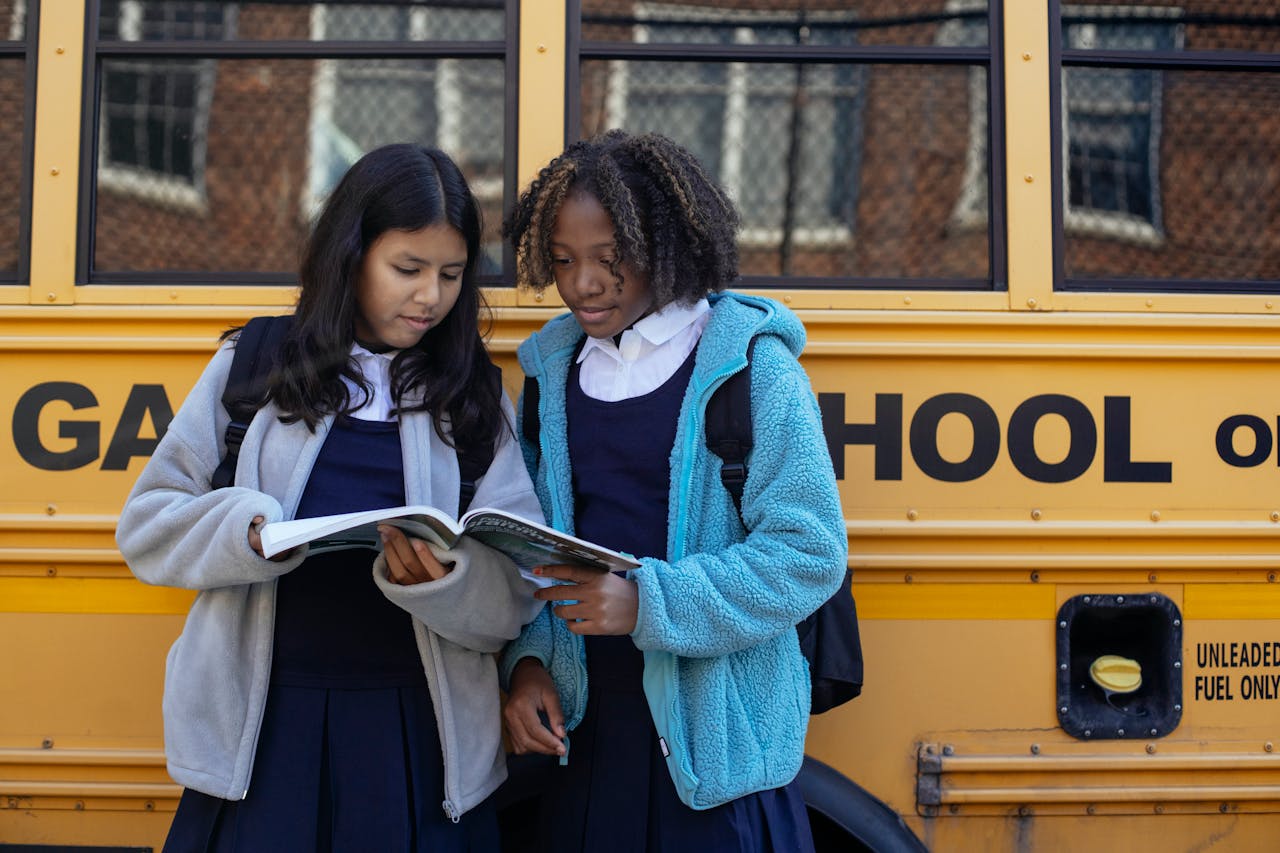 2 Students With A School Bus