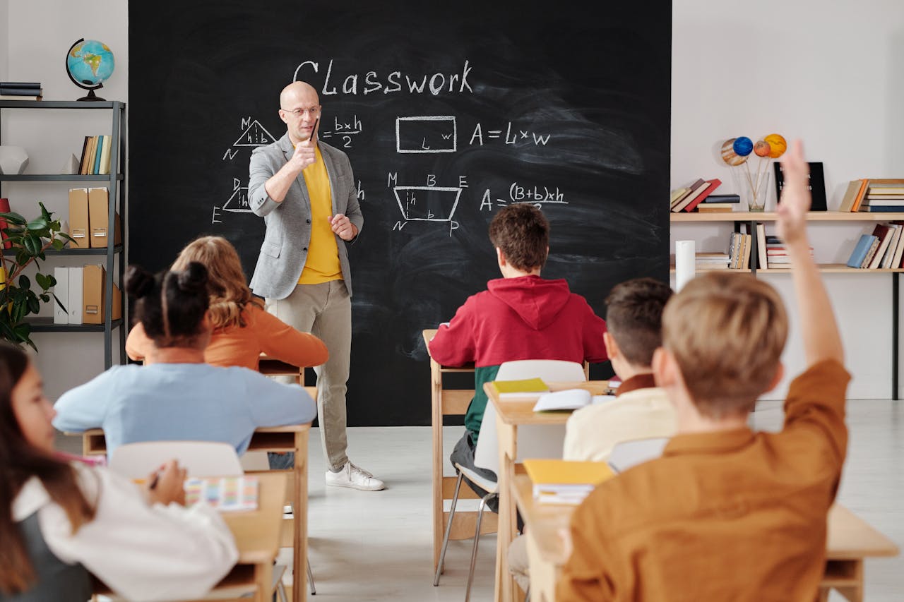 Teacher Teaching Students In A Small Classroom
